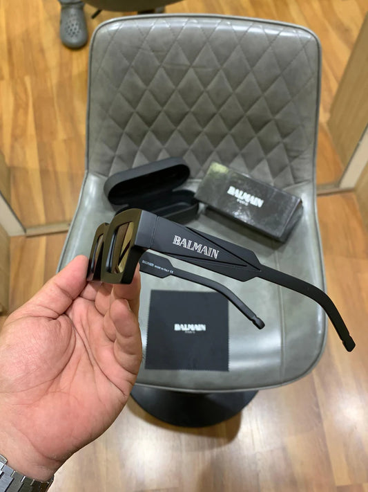 Balmain Matte Black Rectangular Sunglasses with Bold Angular Frames and Dark Tinted Lenses